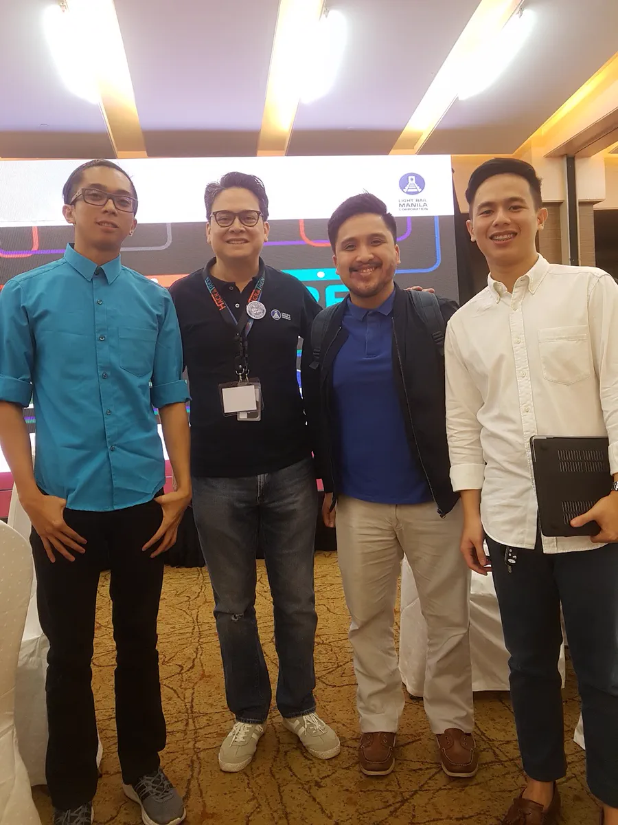 Four members of the TrainsPh team standing together at the HACKATREN venue